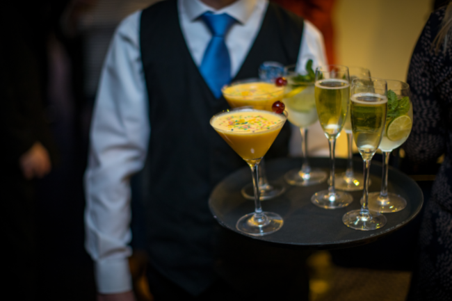 1599 team serving drinks